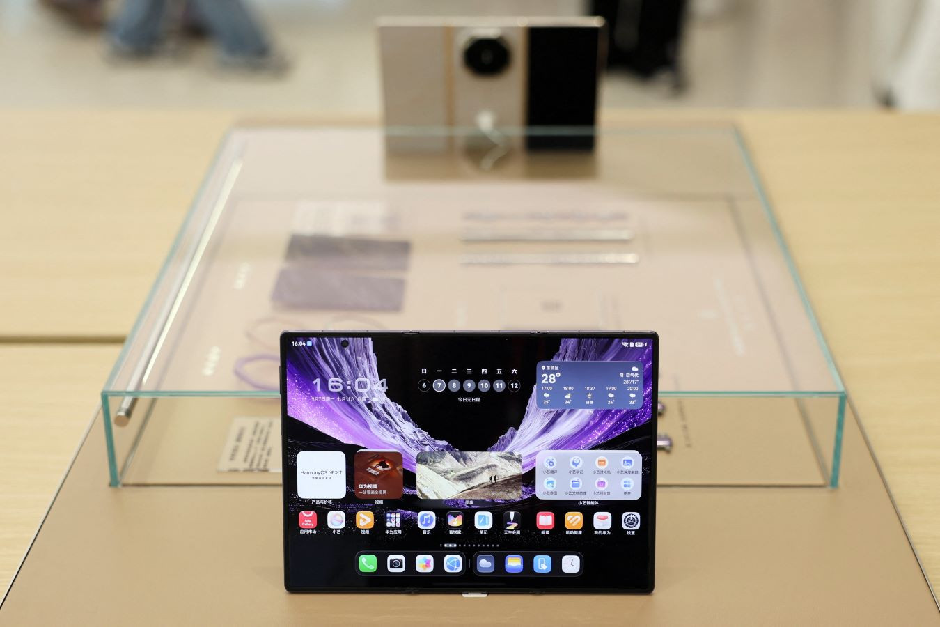 The HarmonyOS operating system running on a  Huawei Mate XT2 foldable smartphone displayed at a Huawei store in Beijing, China September 7, 2026. REUTERS