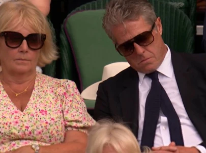 hugh grant goes viral for dozing off at wimbledon next to queen camilla hugh grant goes viral for dozing off at wimbledon next to queen camilla