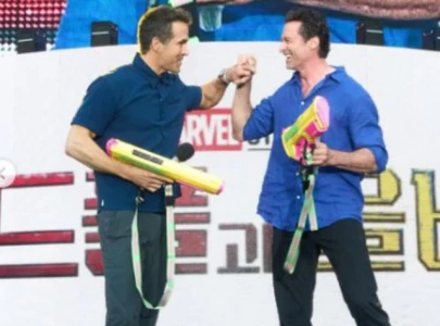 ryan reynolds and hugh jackman drenched during waterbomb festival in south korea