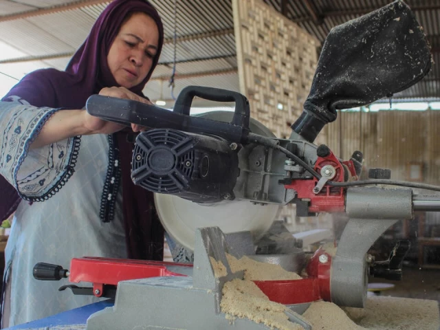 a woman works at a carpentry workshop in karimabad in the hunza district of pakistan s gilgit baltistan region photo afp a woman works at a carpentry workshop in karimabad in the hunza district of pakistan s gilgit baltistan region photo afp