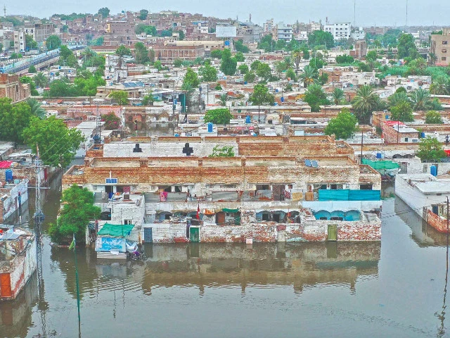 residents of hyderabad s railway colony remain stranded as rainwater submerges the locality forcing people to stay indoors or venture out at their own peril while civic authorities appear indifferent to draining the accumulated water photo inp