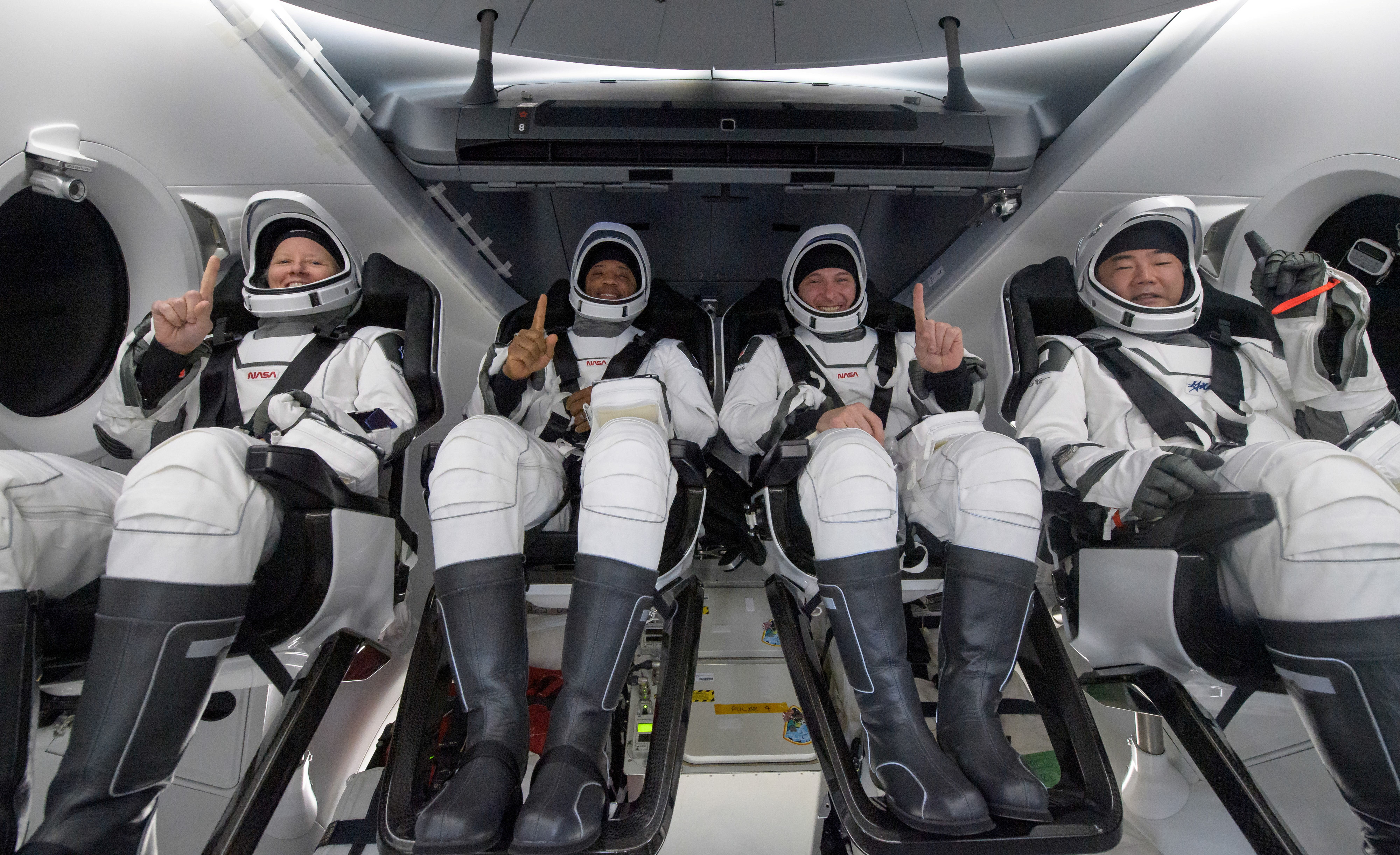 nasa astronauts shannon walker left victor glover mike hopkins and japan aerospace exploration agency jaxa astronaut soichi noguchi react inside the spacex crew dragon resilience spacecraft onboard the spacex go navigator recovery ship shortly after having landed in the gulf of mexico off the coast of panama city florida us may 2 2021 photo reuters