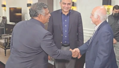 icc deputy chairman imran khawaja and bcb president aminul islam shake hands as pcb chairman mohsin naqvi looks on during a meeting at the pcb headquarters in lahore photo express