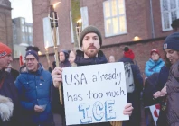 man displays a sign as demonstrators take part in a protest under the slogan greenland is for greenlanders in front of the us embassy in copenhagen photo reuters