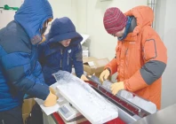 researchers examine an ice core sample taken from a glacier in the pamir mountain range in tajikistan at the hokkaido university institute of low temperature science in sapporo in northern japan s hokkaido prefecture photo afp