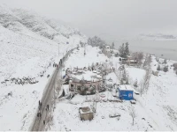 fresh snowfall transforms quetta s rugged terrain into a stark winter vista with travellers moving along a snow lined road photo nni fresh snowfall transforms quetta s rugged terrain into a stark winter vista with travellers moving along a snow lined road photo nni