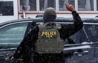 an immigration and customs enforcement agent raises a finger moments after detaining a man during an immigration raid in minneapolis minnesota us january 18 2026 photo reuters