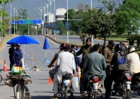 pakistani police officer divert bikers from a road leading to serena hotel as pakistan prepares to host the us and iran for the second phase of peace talks in islamabad on april 22 2026 photo reuters
