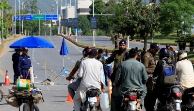 pakistani police officer divert bikers from a road leading to serena hotel as pakistan prepares to host the us and iran for the second phase of peace talks in islamabad on april 22 2026 photo reuters
