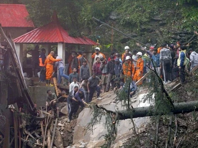 rescue workers remove the debris as they search for survivors after a landslide following torrential rain in shimla in the northern state of himachal pradesh india on august 14 photo reuters