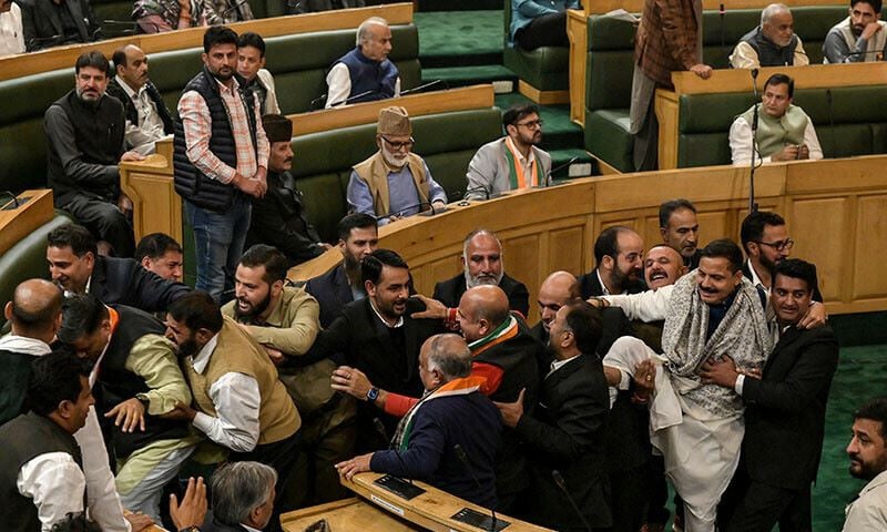 members of the legislative assembly from the bharatiya janata party are being taken out of the house by marshals amid a protest against the resolution to restore special status for jammu and kashmir during an assembly session in srinagar on november 8 photo afp