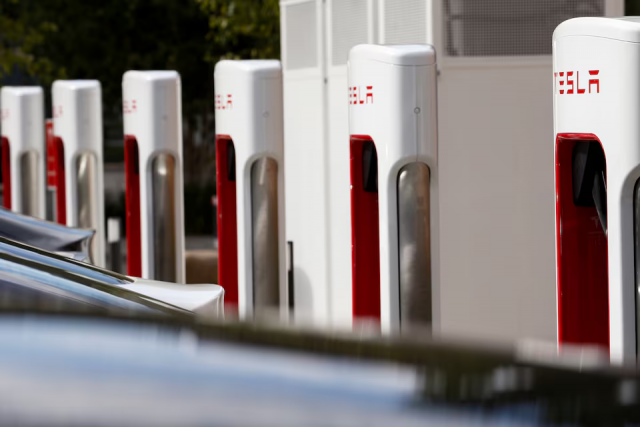 tesla cars are seen next to the v3 supercharger equipment during the presentation of the new charge system in the euref campus in berlin germany september 10 2020 photo reuters