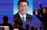 a portrait of chinese president xi jinping is seen on the screen as participants attend the opening ceremony for the inaugural global governance forum in xiongan new area hebei province china october 23 2026 reuters