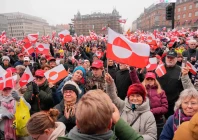 protesters wave greenlandic flags as they take part in a rally under the slogans hands off greenland and greenland for greenlanders in front of the city hall in copenhagen denmark on january 17 photo afp