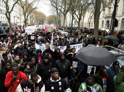 thousands protest in paris over death of migrant worker