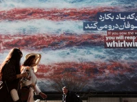 iranian women walk past an anti u s billboard in tehran iran february 19 2026 reuters iranian women walk past an anti u s billboard in tehran iran february 19 2026 reuters