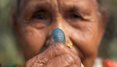 laxmi maya dhimal 71 shows her ink marked thumb after casting her vote outside a polling station at a village in jhapa district nepal march 5 2026 photo reuters
