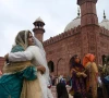muslim devotees greet each other after offering eid prayers at the historical badshahi mosque during the eid photo afp muslim devotees greet each other after offering eid prayers at the historical badshahi mosque during the eid photo afp