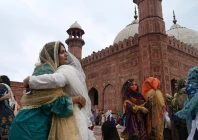 muslim devotees greet each other after offering eid prayers at the historical badshahi mosque during the eid photo afp muslim devotees greet each other after offering eid prayers at the historical badshahi mosque during the eid photo afp