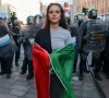a woman holds an italian flag in front of police and finance police in riot gear as people attend a spontaneous demonstration against the rising cost of living a week after protests ended in clashes and looting in northern cities in milan italy october 24 2026 reuters