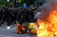 french crs riot police run past objects set on fire amid clashes with protesters during a demonstration by high school and university students supported by teachers union and school parents as part of a nationwide day of demonstrations and blockades voicing anger over overcrowded classrooms teacher shortages and dilapidated school buildings which students blame on years of underinvestment in paris france october 6 2026 reuters