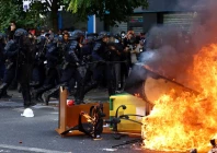 french crs riot police run past objects set on fire amid clashes with protesters during a demonstration by high school and university students supported by teachers union and school parents as part of a nationwide day of demonstrations and blockades voicing anger over overcrowded classrooms teacher shortages and dilapidated school buildings which students blame on years of underinvestment in paris france october 6 2026 reuters