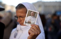 a person holds a picture of pope leo on the day of a mass marking the 10th anniversary of the apostolic exhortation amoris laetitia including special prayers for the health of pope leo who is in a hospital after lung surgery in st peter s square at the vatican october 14 2026 reuters