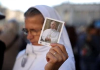 a person holds a picture of pope leo on the day of a mass marking the 10th anniversary of the apostolic exhortation amoris laetitia including special prayers for the health of pope leo who is in a hospital after lung surgery in st peter s square at the vatican october 14 2026 reuters