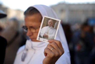 a person holds a picture of pope leo on the day of a mass marking the 10th anniversary of the apostolic exhortation amoris laetitia including special prayers for the health of pope leo who is in a hospital after lung surgery in st peter s square at the vatican october 14 2026 reuters