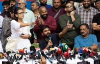 abhijeet dipke founder of the cockroach janata party cjp and neha bora national president of the all india students association aisa gesture as they addresses a press conference in new delhi india october 15 2026 reuters