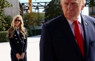 white house press secretary katie zacharia stands behind us president donald trump as he departs the white house in washington dc us october 13 2026 reuters