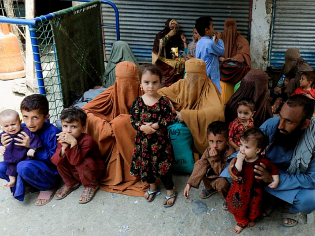 muhammad ismail 40 sits with his family while they are waiting to cross main afghanistan pakistan land border crossing in torkham pakistan september 15 2023 photo reuters
