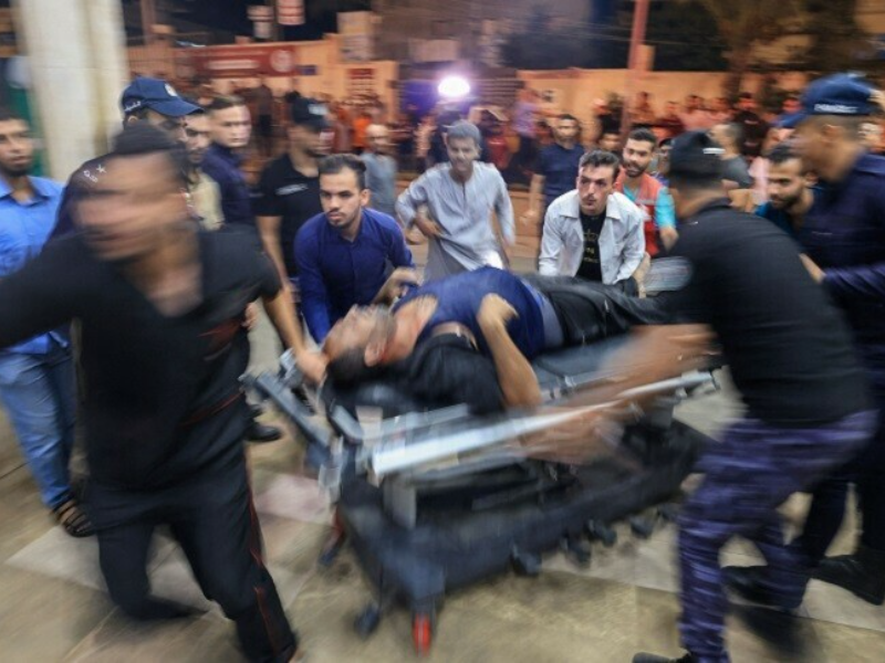 a palestinian man injured in an israeli air strike is wheeled inside the nasser hospital in khan yunis in the southern of gaza strip on tuesday oct 17 photo afp