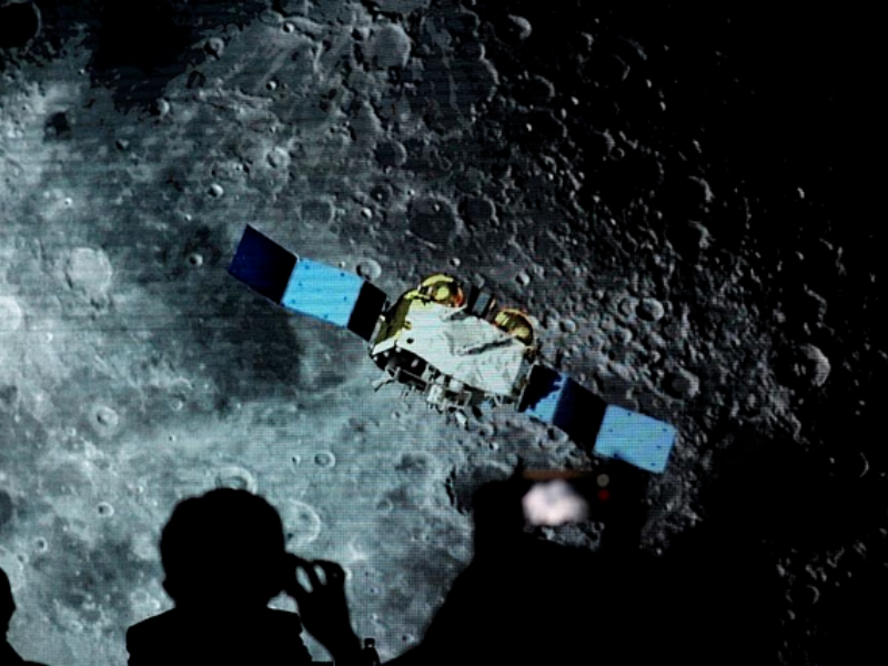 a screen shows footages of spacecraft for chang e 5 mission during an event on china s lunar exploration program at the national astronomical observatories of chinese academy of sciences cas in beijing china january 18 2021 photo reuters