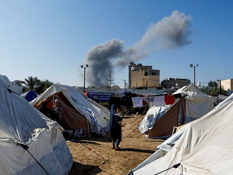 smoke rises from nearby israeli strikes as seen from a tent camp sheltering displaced palestinians as the conflict between israel and palestinian islamist group hamas continues in khan younis in the southern gaza strip october 26 2023 photo reuters