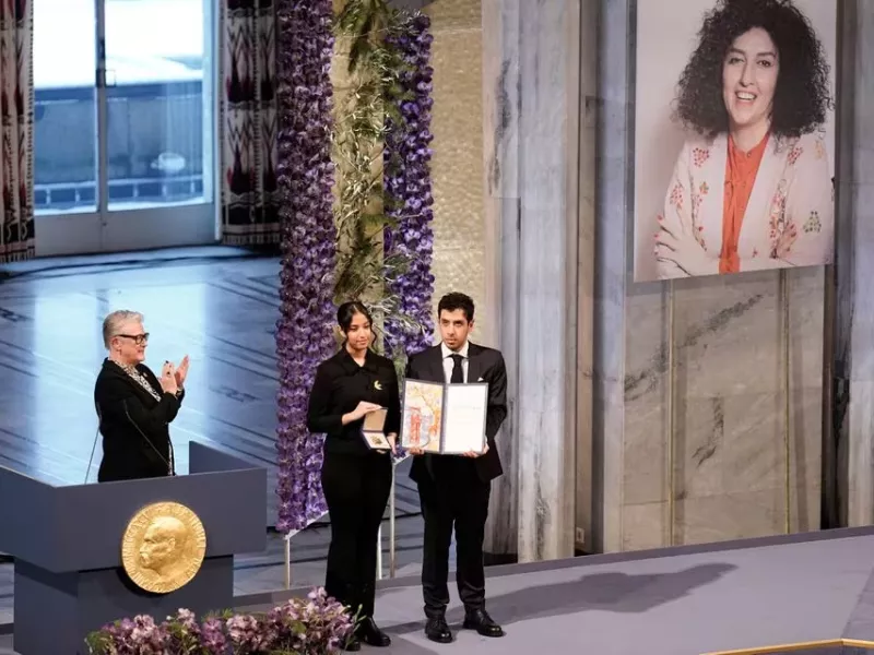 ali and kiana rahmani children of narges mohammadi an imprisoned iranian human rights activist hold the nobel peace prize 2023 award accepting it on behalf of their mother at oslo city hall norway december 10 2023 photo reuters