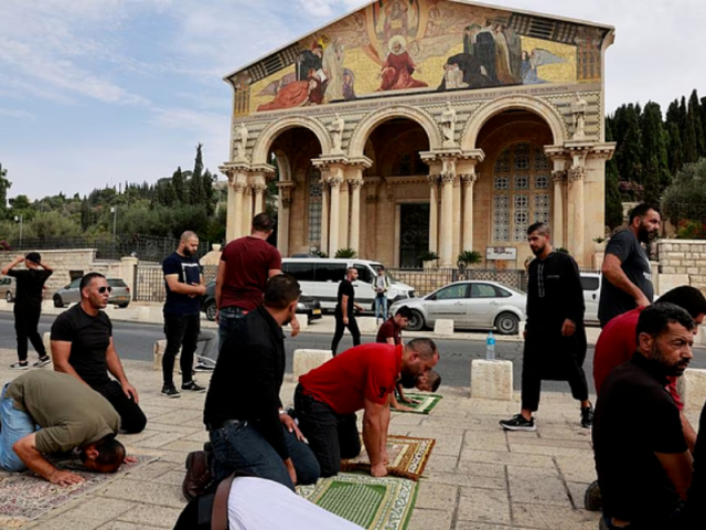 muslim palestinians hold friday prayers by a road outside the old city of jerusalem as the conflict between israel and hamas continues in jerusalem october 27 2023 photo reuters