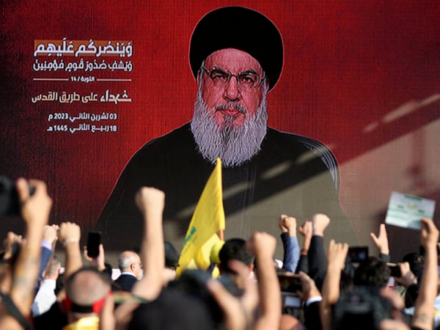 lebanon s hezbollah leader sayyed hassan nasrallah appears on a screen as he addresses his supporters during a ceremony to honour fighters killed in the recent escalation with israel in beirut s southern suburbs lebanon november 3 2023 photo reuters