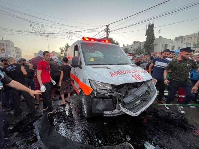 palestinians check the damages after a convoy of ambulances was hit at the entrance of shifa hospital in gaza city on november 3 2023 photo reuters