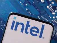 a smartphone with an intel logo displayed is placed on a computer motherboard in this illustration source reuters