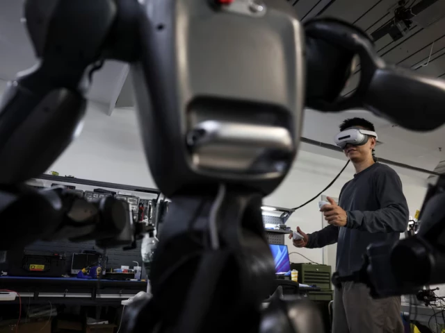 an engineer wearing vr goggles uses a controller to operate a spirit ai s moz1 robot at a testing area in the company s headquarters in beijing china september 17 2026 photo reuters an engineer wearing vr goggles uses a controller to operate a spirit ai s moz1 robot at a testing area in the company s headquarters in beijing china september 17 2026 photo reuters