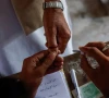 a voter gets an ink mark on his thumb after casting his vote during the general election in karachi photo reuters