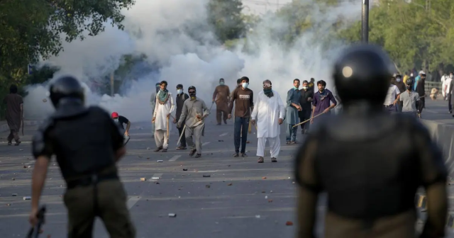 supporters of pakistan tehreek e insaf pti supremo imran khan throw stones after police fire tear gas to disperse them in lahore on may 9 2023 file photo supporters of pakistan tehreek e insaf pti supremo imran khan throw stones after police fire tear gas to disperse them in lahore on may 9 2023 file photo