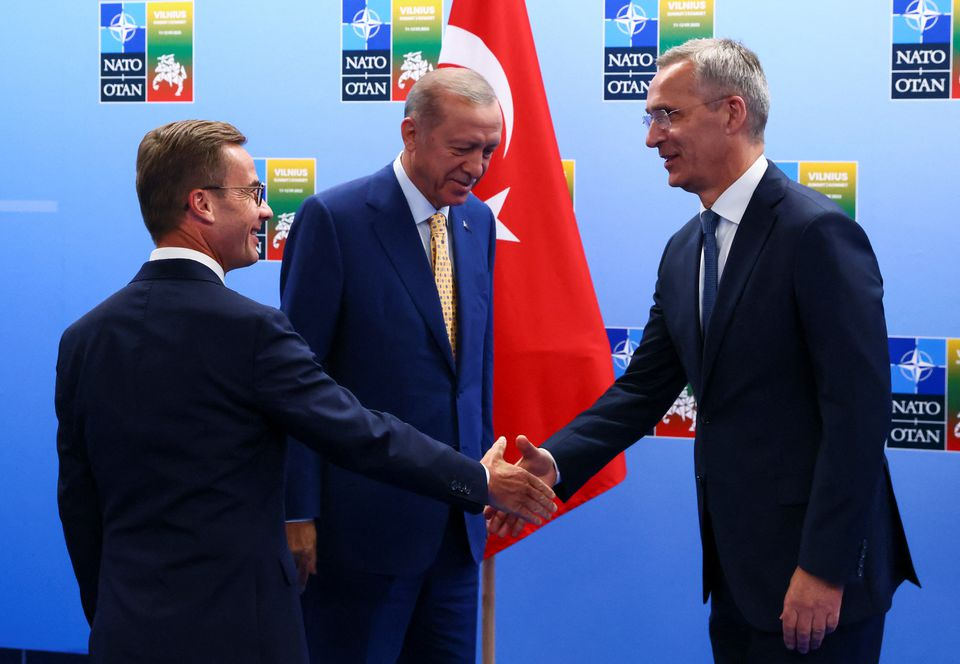 swedish prime minister ulf kristersson and nato secretary general jens stoltenberg shake hands next to turkish president tayyip erdogan on the eve of a nato summit in vilnius lithuania july 10 2023 photo reuters