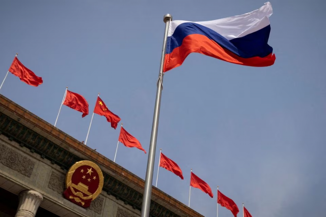 the russian flag flies in front of the great hall of the people before a welcoming ceremony for russian prime minister mikhail mishustin in beijing china may 24 2023 photo reuters file the russian flag flies in front of the great hall of the people before a welcoming ceremony for russian prime minister mikhail mishustin in beijing china may 24 2023 photo reuters file