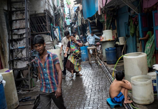 residents walk in an alley in dharavi one of asia s largest slums in mumbai march 12 2015 photo reuters file residents walk in an alley in dharavi one of asia s largest slums in mumbai march 12 2015 photo reuters file