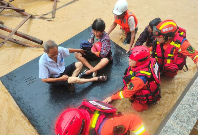 firefighters evacuate residents stranded by floodwaters after typhoon doksuri made landfall in quanzhou fujian province china july 28 2023 photo reuters firefighters evacuate residents stranded by floodwaters after typhoon doksuri made landfall in quanzhou fujian province china july 28 2023 photo reuters