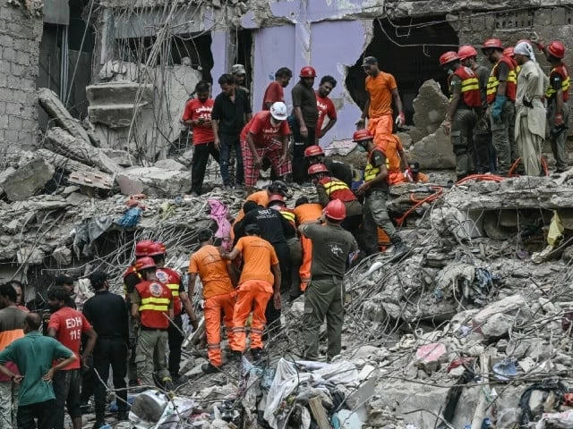rescuers scramble through rubble after a multi storey residential building collapses in karachi photo afp rescuers scramble through rubble after a multi storey residential building collapses in karachi photo afp
