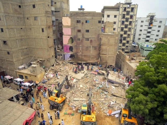 rescuers scramble through rubble after a multi storey residential building crumbles in karachi photo ppi rescuers scramble through rubble after a multi storey residential building crumbles in karachi photo ppi