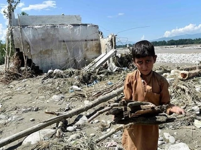 a boy standing near damaged house following heavy monsoon rains in mingora on august 28 2022 photo afp a boy standing near damaged house following heavy monsoon rains in mingora on august 28 2022 photo afp
